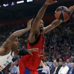 CSKA Moscow's Kyle Hines, right, jumps for a lost ball as Real Madrid's Trey Thompkins tries to block him during their Final Four Euroleague semifinal basketball match in Belgrade, Serbia, Friday, May 18, 2018. (AP Photo/Darko Vojinovic)