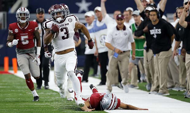 FILE - In this Sept. 23, 2017, file photo, Texas A&M wide receiver Christian Kirk (3) evades Ar...