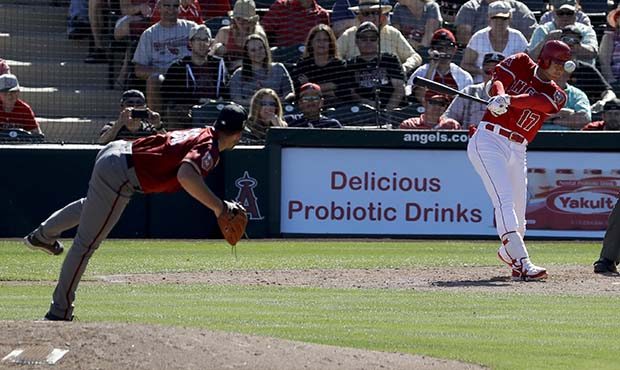 Los Angeles Angels' Shohei Ohtani, of Japan, watches his base hit off Arizona Diamondbacks pitcher ...