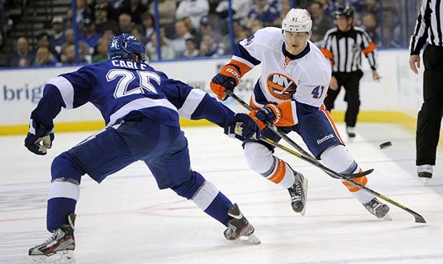 New York Islanders left wing David Ullstrom (41) and Tampa Bay Lightning defenseman Matt Carle (25)...