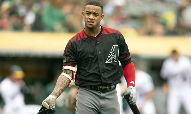 Arizona Diamondbacks Ketel Marte (4) tosses his helmet after striking out to end the top half of th...