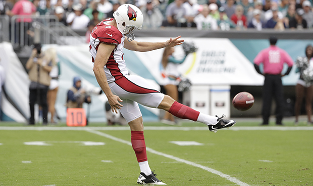 Arizona Cardinals' Andy Lee punts during the first half of an NFL football game against the Philade...