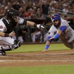 New York Mets center fielder Jose Bautista is tagged out at the plate by Arizona Diamondbacks catcher Alex Avila while trying to score on a fly ball hit by Amed Rosario during the second inning of a baseball game, Friday, June 15, 2018, in Phoenix. (AP Photo/Matt York)