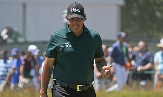 Phil Mickelson reacts to his putt on the third hole during the third round of the U.S. Open Golf Ch...
