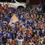 New York Mets fans celebrate a three-run home run by Mets' Michael Conforto against the Arizona Diamondbacks during the second inning of a baseball game Saturday, June 16, 2018, in Phoenix. (AP Photo/Ross D. Franklin)