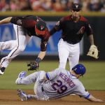 New York Mets' Devin Mesoraco (29) upends Arizona Diamondbacks shortstop Nick Ahmed, left, after Mesoraco was forced out at second base as Diamondbacks' Ketel Marte, back right, watches during the fourth inning of a baseball game Saturday, June 16, 2018, in Phoenix. (AP Photo/Ross D. Franklin)