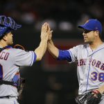 New York Mets relief pitcher Anthony Swarzak (38) gives a high-five to catcher Devin Mesoraco after the Mets defeated the Arizona Diamondbacks 5-1 in a baseball game Saturday, June 16, 2018, in Phoenix. (AP Photo/Ross D. Franklin)