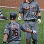 Arizona Diamondbacks' Paul Goldschmidt (44) is greeted by Chris Owings after scoring against the Pittsburgh Pirates in the third inning of a baseball game, Saturday, June 23, 2018, in Pittsburgh. (AP Photo/Keith Srakocic)