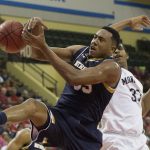 Notre Dame forward Bonzie Colson (35) fights for the rebound with Monmouth center Zac Tillman (33) during the first half of an NCAA college basketball game Thursday, Nov. 26, 2015, in Orlando, Fla. (AP Photo/Willie J. Allen Jr.)