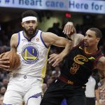 Golden State Warriors' JaVale McGee is defended by Cleveland Cavaliers' George Hill in the first half of Game 4 of basketball's NBA Finals, Friday, June 8, 2018, in Cleveland. (AP Photo/Tony Dejak)