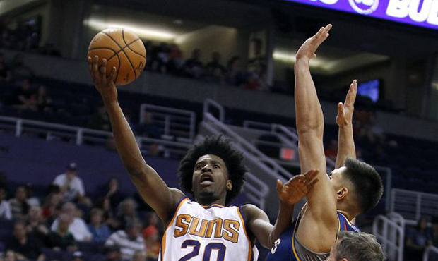 Phoenix Suns forward Josh Jackson (20) drives to the basket past the defense of Brisbane Bullets' D...