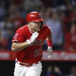 Los Angeles Angels' Mike Trout runs to first base after hitting a two-run single during the fifth inning of the team's baseball game against the Arizona Diamondbacks, Tuesday, June 19, 2018, in Anaheim, Calif. (AP Photo/Jae C. Hong)