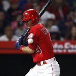 Los Angeles Angels' Ian Kinsler is hit by a pitch during the fifth inning of the team's baseball game against the Arizona Diamondbacks, Tuesday, June 19, 2018, in Anaheim, Calif. (AP Photo/Jae C. Hong)