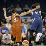Minnesota Lynx Maya Moore (23) becomes entangled with Phoenix Mercury's Diana Taurasi (3) during the first half of a WNBA basketball game Friday, June 1, 2018, in Minneapolis. (David Joles/Star Tribune via AP)