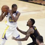 Golden State Warriors' Kevin Durant is defended by Cleveland Cavaliers' JR Smith during the second half of Game 4 of basketball's NBA Finals, Friday, June 8, 2018, in Cleveland. (AP Photo/Carlos Osorio)