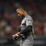 Arizona Diamondbacks' Jarrod Dyson takes off his gloves after he flied out during the fourth inning of the team's baseball game against the Los Angeles Angels, Tuesday, June 19, 2018, in Anaheim, Calif. (AP Photo/Jae C. Hong)