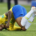 Brazil's Neymar, right, grimaces in pain after a tackle by Serbia's Adem Ljajic during the group E match between Serbia and Brazil, at the 2018 soccer World Cup in the Spartak Stadium in Moscow, Russia, Wednesday, June 27, 2018. (AP Photo/Matthias Schrader)