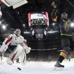 Vegas Golden Knights right wing Reilly Smith, right, celebrates his goal on Washington Capitals goaltender Braden Holtby during the second period in Game 5 of the NHL hockey Stanley Cup Finals on Thursday, June 7, 2018, in Las Vegas. (Harry How/Pool via AP)