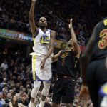 Golden State Warriors' Kevin Durant shoots over Cleveland Cavaliers' Rodney Hood in the first half of Game 4 of basketball's NBA Finals, Friday, June 8, 2018, in Cleveland. (AP Photo/Tony Dejak)