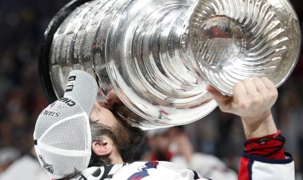 Washington Capitals left wing Alex Ovechkin, of Russia, kisses the Stanley Cup after the Capitals d...