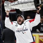 Washington Capitals left wing Alex Ovechkin, of Russia, hoists the Stanley Cup after the Capitals defeated the Golden Knights in Game 5 of the NHL hockey Stanley Cup Finals Thursday, June 7, 2018, in Las Vegas. (AP Photo/John Locher)