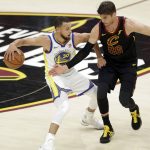 Golden State Warriors' Stephen Curry is defended by Cleveland Cavaliers' Kyle Korver during the first half of Game 4 of basketball's NBA Finals, Friday, June 8, 2018, in Cleveland. (AP Photo/Tony Dejak)