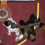 Cleveland Cavaliers' LeBron James shoots over Golden State Warriors' Draymond Green during the first half of Game 4 of basketball's NBA Finals, Friday, June 8, 2018, in Cleveland. (AP Photo/Carlos Osorio, Pool)