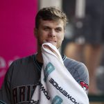 Arizona Diamondbacks starting pitcher Matt Koch wipes his face in the dugout during the third inning of the team's baseball game against the Los Angeles Angels, Tuesday, June 19, 2018, in Anaheim, Calif. (AP Photo/Jae C. Hong)