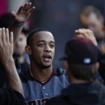 Arizona Diamondbacks' Ketel Marte celebrates his home run with teammates in the dugout during the second inning of a baseball game against the Los Angeles Angels, Monday, June 18, 2018, in Anaheim, Calif. (AP Photo/Jae C. Hong)