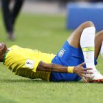 
              Brazil's Neymar grimaces in pain after a tackle by Serbia's Adem Ljajic during the group E match between Serbia and Brazil, at the 2018 soccer World Cup in the Spartak Stadium in Moscow, Russia, Wednesday, June 27, 2018. (AP Photo/Matthias Schrader)
            