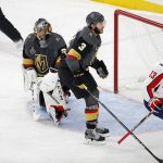 Washington Capitals left wing Jakub Vrana, right, celebrates after scoring past Vegas Golden Knights goaltender Marc-Andre Fleury, left, as defenseman Brayden McNabb skates between them during the second period in Game 5 of the NHL hockey Stanley Cup Finals on Thursday, June 7, 2018, in Las Vegas. (AP Photo/Ross D. Franklin)