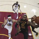 Cleveland Cavaliers' LeBron James shoots against Golden State Warriors' JaVale McGee during the first half of Game 4 of basketball's NBA Finals, Friday, June 8, 2018, in Cleveland. (Kyle Terada/Pool Photo via AP)