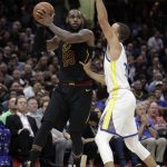 Cleveland Cavaliers' LeBron James looks to pass the ball as Golden State Warriors' Stephen Curry defends during the second half of Game 4 of basketball's NBA Finals, Friday, June 8, 2018, in Cleveland. (AP Photo/Tony Dejak)