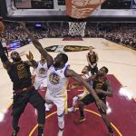 Cleveland Cavaliers' LeBron James shoots against Golden State Warriors' Draymond Green during the first half of Game 4 of basketball's NBA Finals, Friday, June 8, 2018, in Cleveland. (Gregory Shamus/Pool Photo via AP)