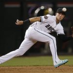 Arizona Diamondbacks third baseman Jake Lamb chases down a line drive hit by San Francisco Giants Andrew McCutchen for an out during the third inning of a baseball game Friday, June 29, 2018, in Phoenix. (AP Photo/Ross D. Franklin)