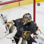 Vegas Golden Knights goaltender Marc-Andre Fleury deflects a shot during the first period in Game 5 of the NHL hockey Stanley Cup Finals against the Washington Capitals on Thursday, June 7, 2018, in Las Vegas. (AP Photo/Ross D. Franklin)