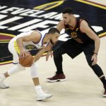 Golden State Warriors' Stephen Curry is defended by Cleveland Cavaliers' Larry Nance Jr. during the first half of Game 4 of basketball's NBA Finals, Friday, June 8, 2018, in Cleveland. (AP Photo/Tony Dejak)