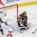 Vegas Golden Knights defenseman Deryk Engelland, right, stops a shot with his stick as Washington Capitals left wing Alex Ovechkin, left, of Russia, reaches in and goaltender Marc-Andre Fleury defends during the first period in Game 5 of the NHL hockey Stanley Cup Finals on Thursday, June 7, 2018, in Las Vegas. (AP Photo/Ross D. Franklin)