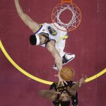 Cleveland Cavaliers' Larry Nance Jr. and Golden State Warriors' JaVale McGee go for a rebound during the second half of Game 4 of basketball's NBA Finals, Friday, June 8, 2018, in Cleveland. (AP Photo/Carlos Osorio, Pool)