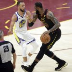 Golden State Warriors' Stephen Curry defends against Cleveland Cavaliers' LeBron James during the first half of Game 4 of basketball's NBA Finals, Friday, June 8, 2018, in Cleveland. (AP Photo/Tony Dejak)