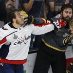 Washington Capitals defenseman John Carlson, left, and Vegas Golden Knights right wing Alex Tuch tussle during the second period in Game 5 of the NHL hockey Stanley Cup Finals on Thursday, June 7, 2018, in Las Vegas. (AP Photo/Ross D. Franklin)