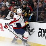 Washington Capitals left wing Andre Burakovsky, left, collides with Vegas Golden Knights defenseman Luca Sbisa during the first period in Game 5 of the NHL hockey Stanley Cup Finals Thursday, June 7, 2018, in Las Vegas. (AP Photo/John Locher)