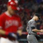 Arizona Diamondbacks starting pitcher Matt Koch, right, looks at the ball after hitting Los Angeles Angels' Ian Kinsler with a pitch during the fifth inning of a baseball game Tuesday, June 19, 2018, in Anaheim, Calif. (AP Photo/Jae C. Hong)