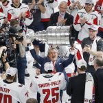Washington Capitals team owner Ted Leonsis hoists the Stanley Cup after after the Capitals defeated the Golden Knights 4-3 in Game 5 of the NHL hockey Stanley Cup Finals Thursday, June 7, 2018, in Las Vegas. (AP Photo/Ross D. Franklin)