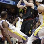 Cleveland Cavaliers' Kevin Love shoots against Golden State Warriors' Kevin Durant during the second half of Game 4 of basketball's NBA Finals, Friday, June 8, 2018, in Cleveland. (AP Photo/Tony Dejak)