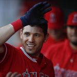 Los Angeles Angels' Ian Kinsler celebrates with teammates in the dugout after his home run during the first inning of a baseball game against the Arizona Diamondbacks, Tuesday, June 19, 2018, in Anaheim, Calif. (AP Photo/Jae C. Hong)