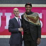 Duke's Wendell Carter Jr., right, poses with NBA Commissioner Adam Silver after he was picked seventh overall by the Chicago Bulls during NBA basketball draft in New York, Thursday, June 21, 2018. (AP Photo/Kevin Hagen)