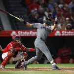Arizona Diamondbacks' David Peralta follows through on an RBI double during the fifth inning of the team's baseball game against the Los Angeles Angels, Tuesday, June 19, 2018, in Anaheim, Calif. (AP Photo/Jae C. Hong)