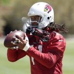 Arizona Cardinals' Larry Fitzgerald makes a catch during practice at the NFL football team's training camp, Tuesday, June 12, 2018, in Tempe, Ariz. (AP Photo/Matt York)