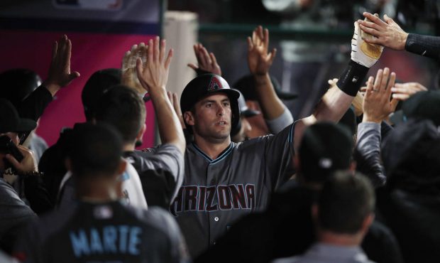 Arizona Diamondbacks' Paul Goldschmidt, center, is congratulated by teammates after hitting a two-r...